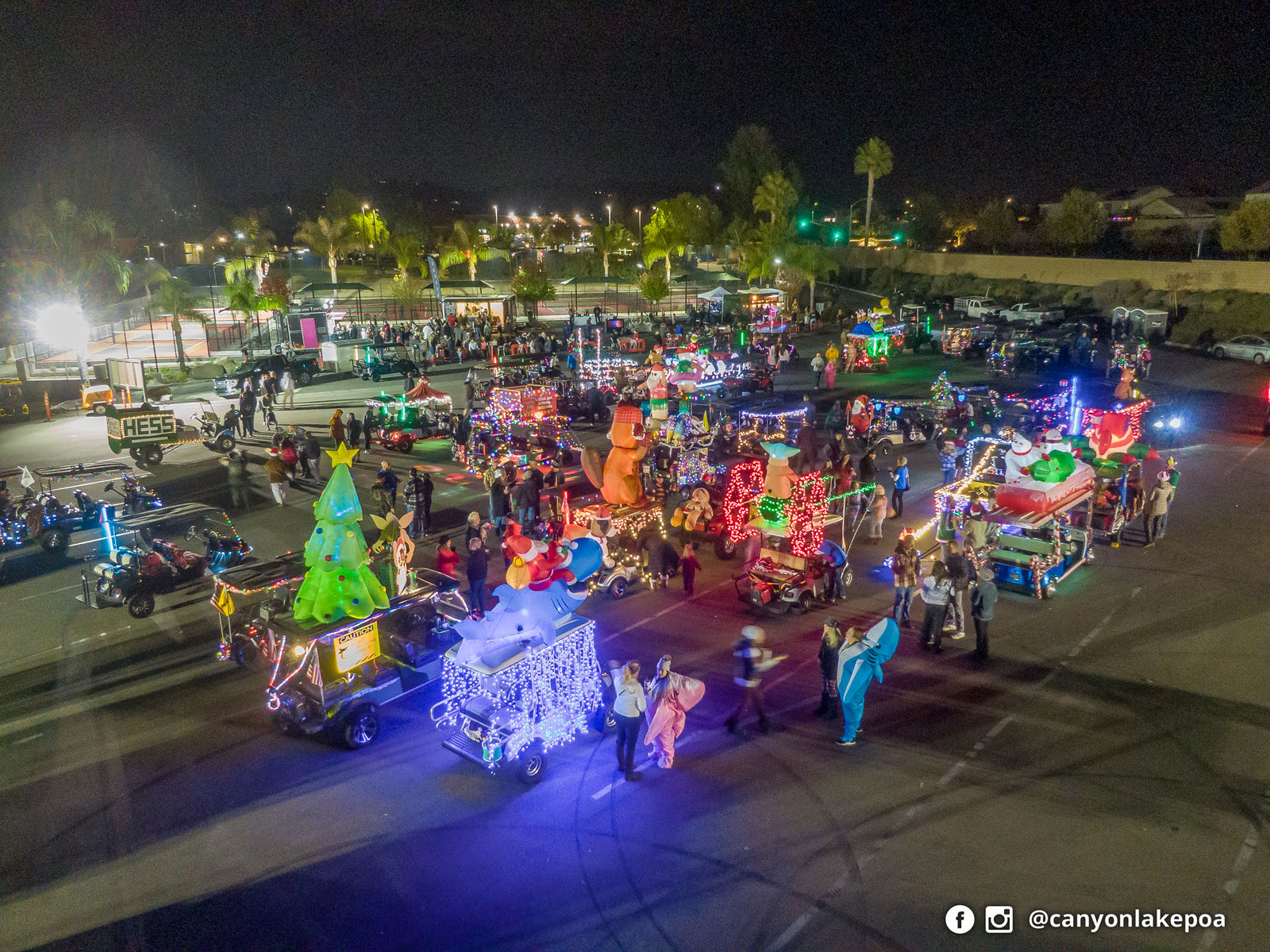 Decorated golf carts and neighbors gather at Canyon Lake’s Christmas parade on December 3, 2023.