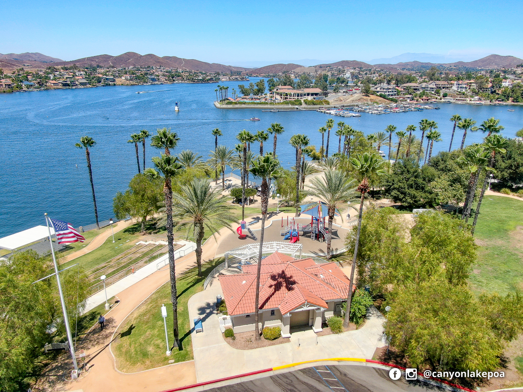 Aerial view of Holiday Harbor Park beside Canyon Lake, with its shoreline, lawn, and recreation areas.